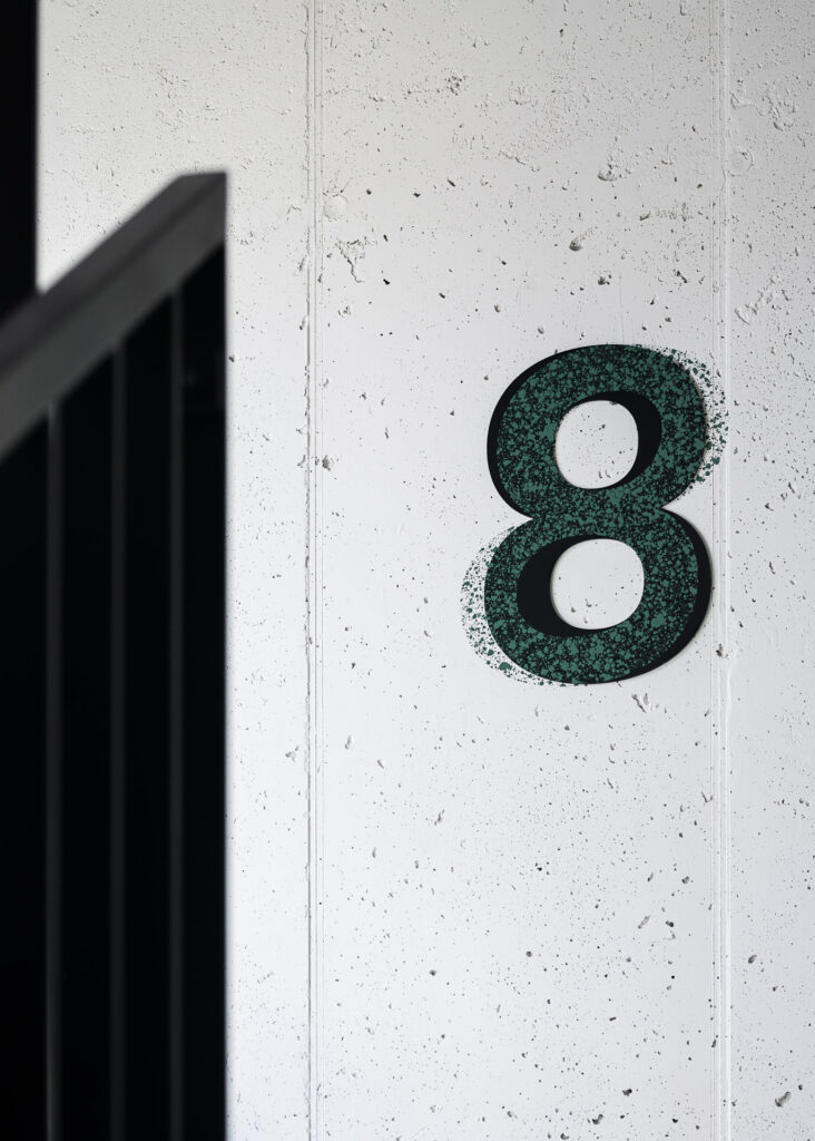 Concrete wall with floor signage in Urban Home