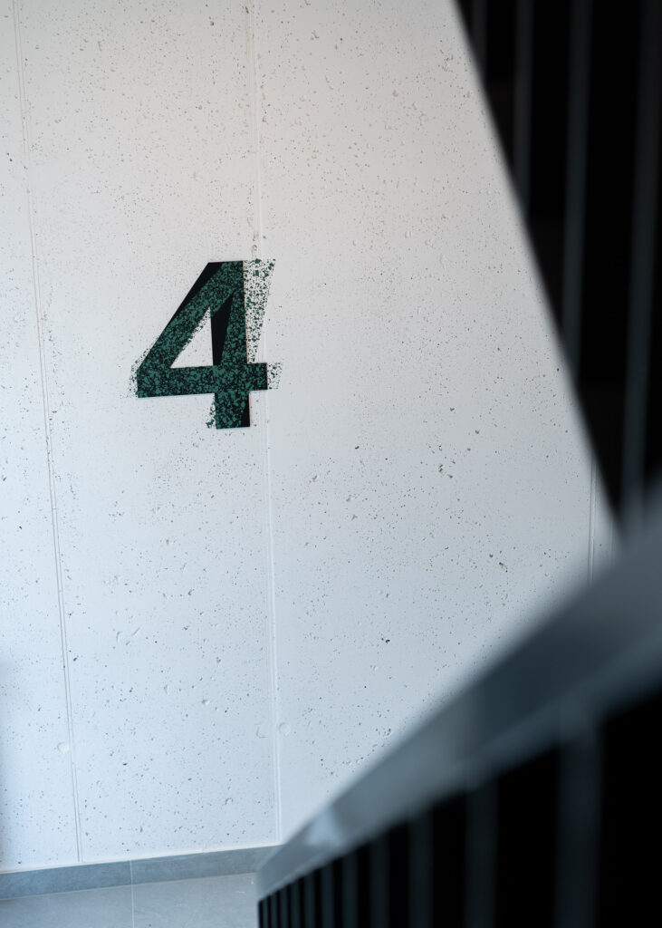 Typographical floor number in the staircase