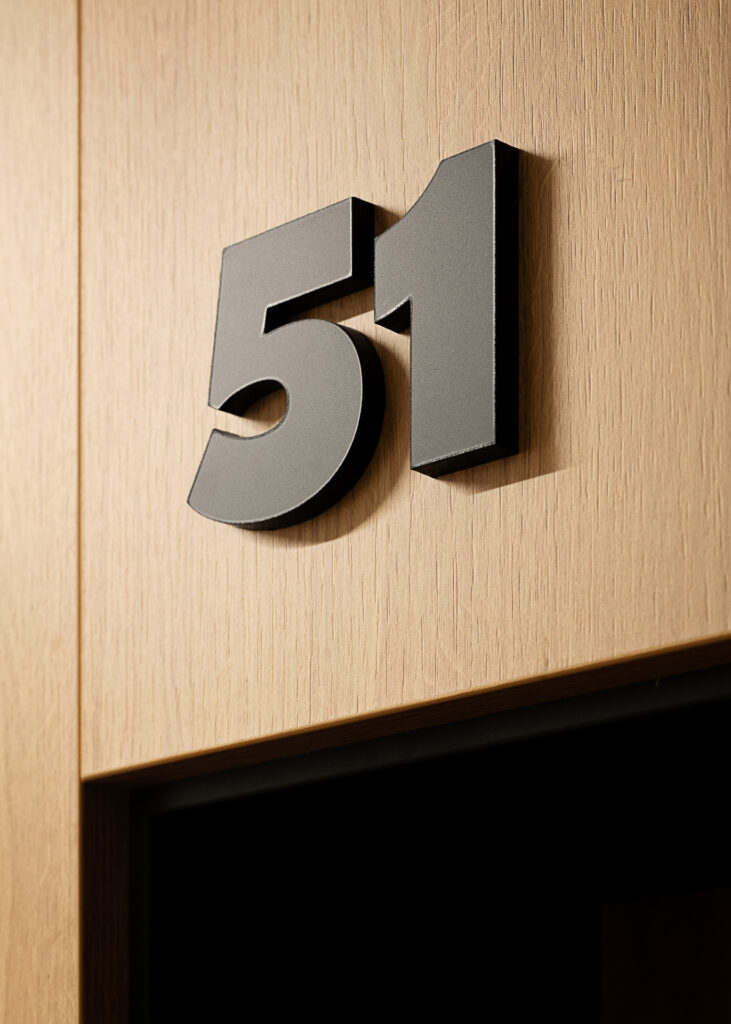 ATAL SKY+ Katowice residential wayfinding acrylic number