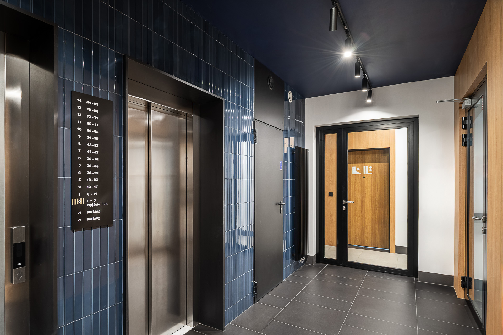 ATAL SKY+ Katowice residential wayfinding elevator signage