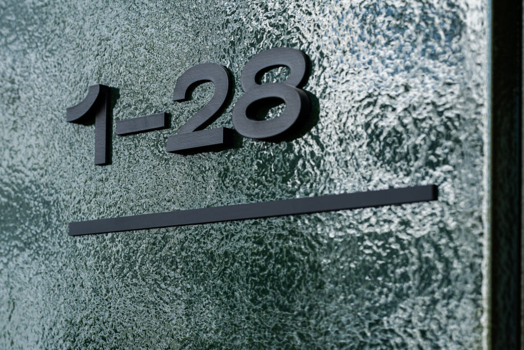 Wayfinding system Młyny Mogilska Noho Investment entrance detail