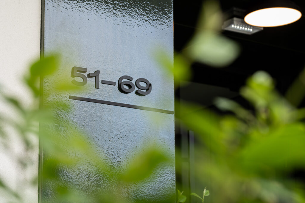 Wayfinding system Młyny Mogilska Noho Investment entrance detail number