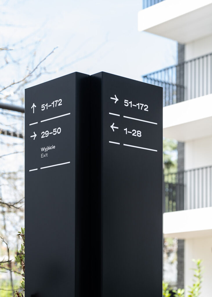 Wayfinding system Młyny Mogilska Noho Investment outside totem