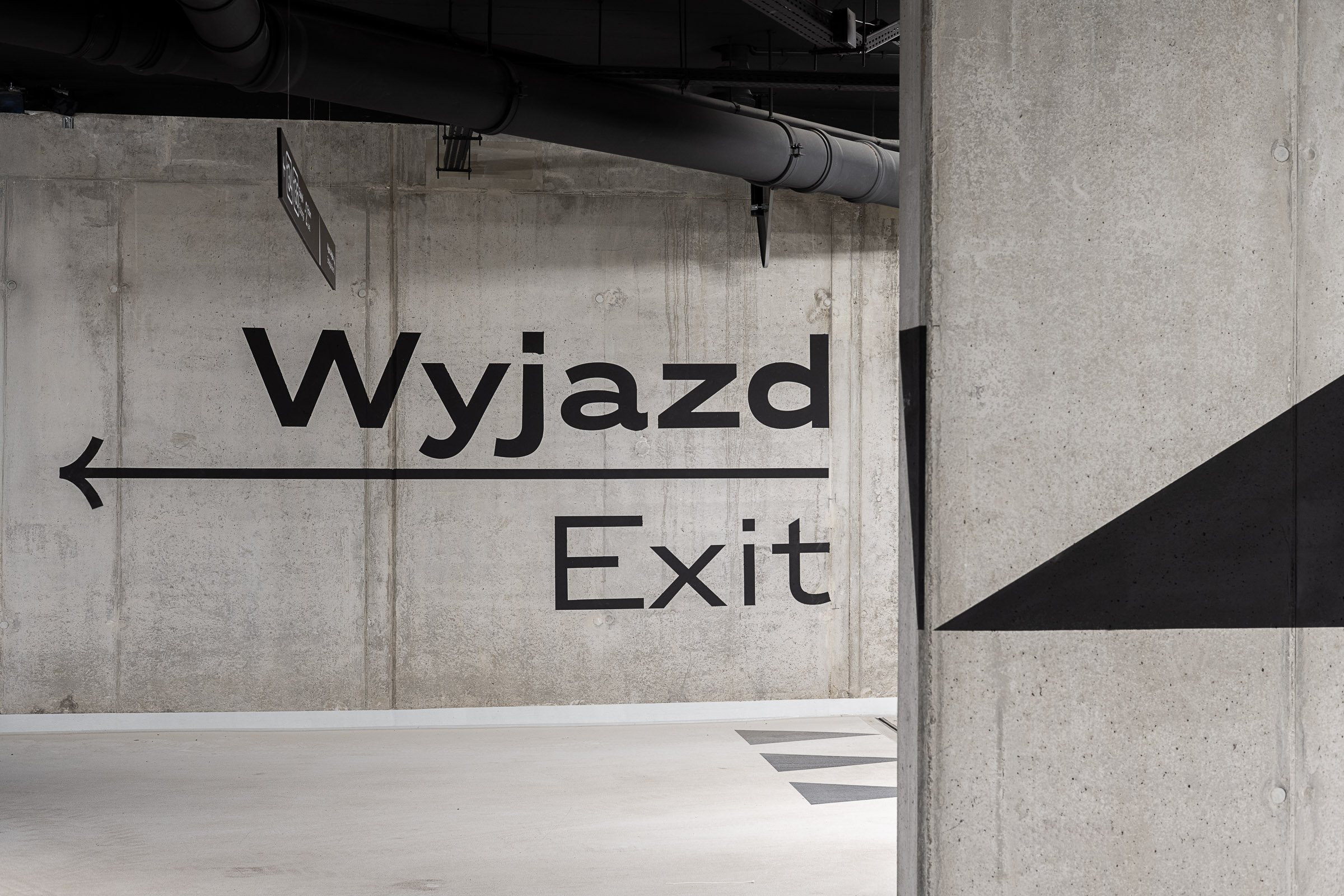 System informacji wizualnej Noho Investment Młyny Mogilska grafika kierunkowa environmental graphics