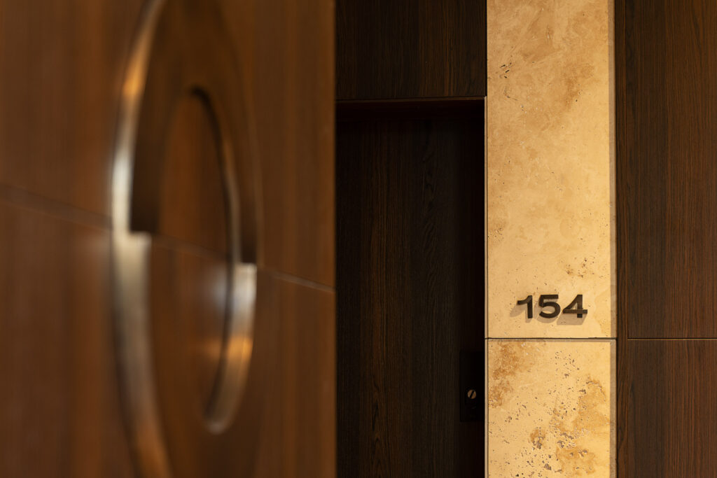 Wayfinding system Młyny Mogilska Noho Investment brass casting