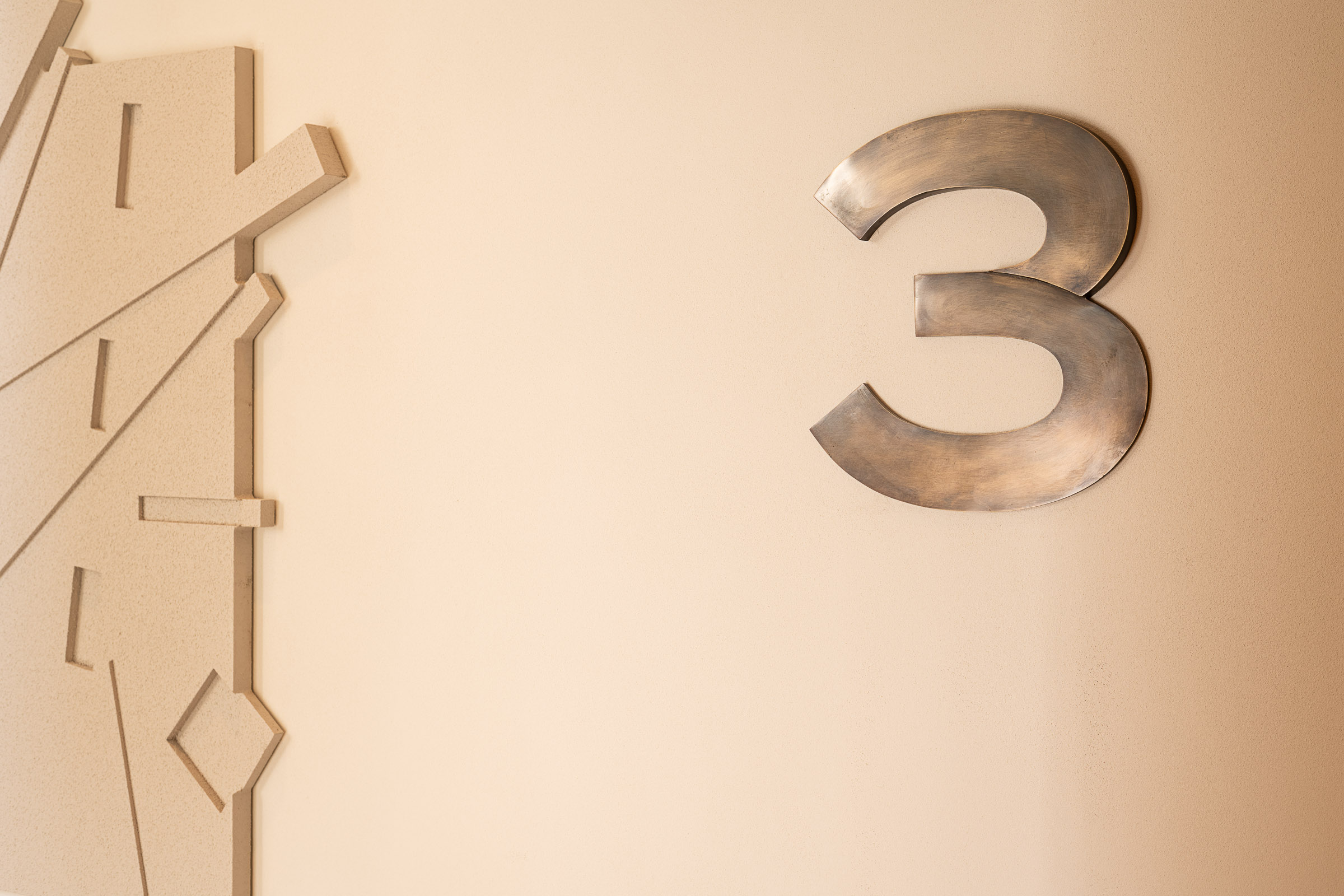 Wayfinding system Młyny Mogilska Noho Investment brass casting floor number