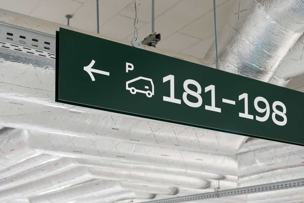 Wayfinding system residential building directional hanging carrier in the parking