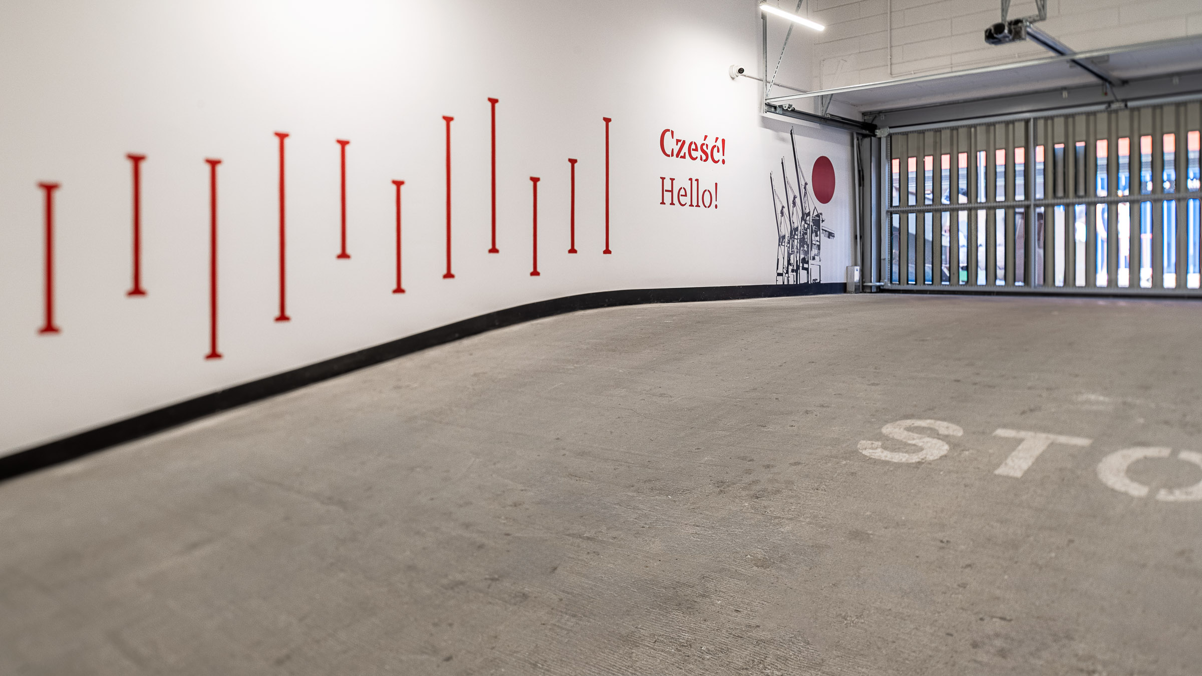 Doki Living Gdansk residential building space branding in the parking