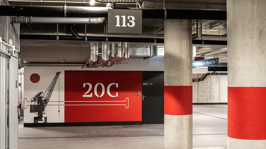 Doki Living Gdansk residential building graphics and wayfinding system