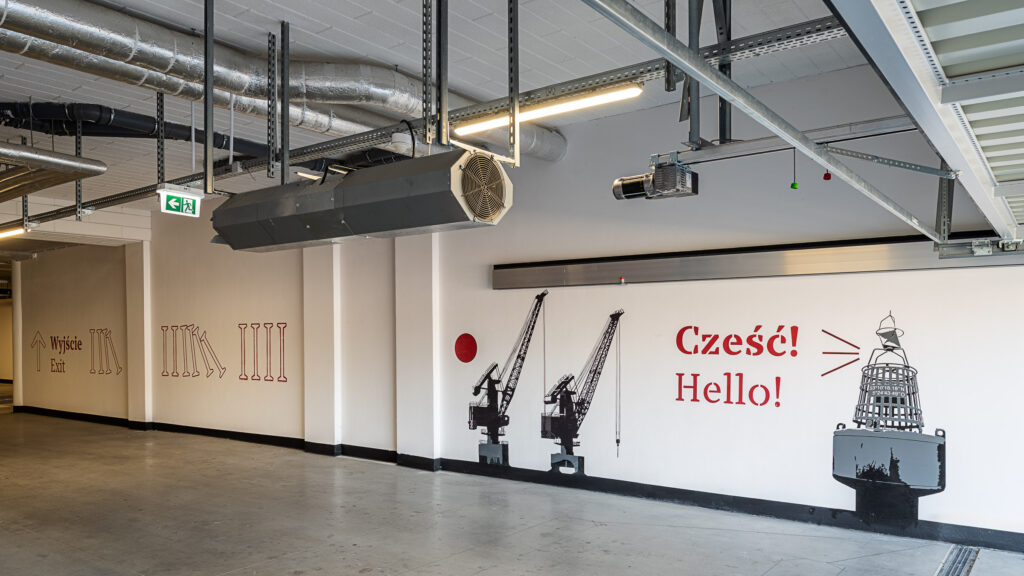 Doki Living II Gdańsk wayfinding parkingu podziemnego w budynku mieszkalnym