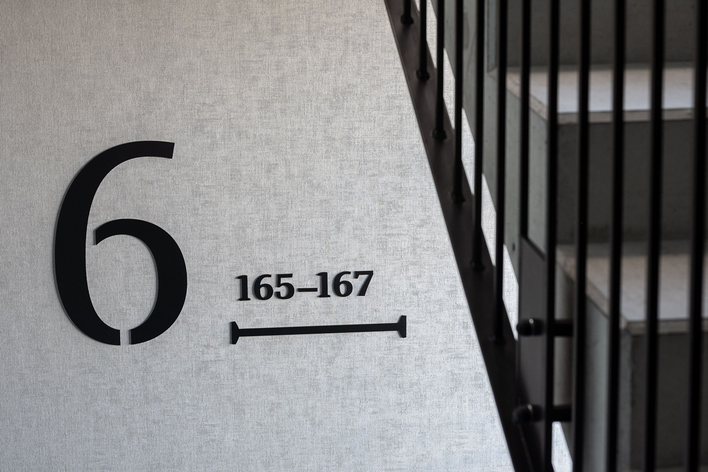 Doki Living Gdansk residential building staircase wayfinding system
