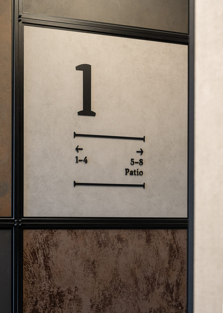 Doki Living Gdansk residential building corridor directional wayfinding system