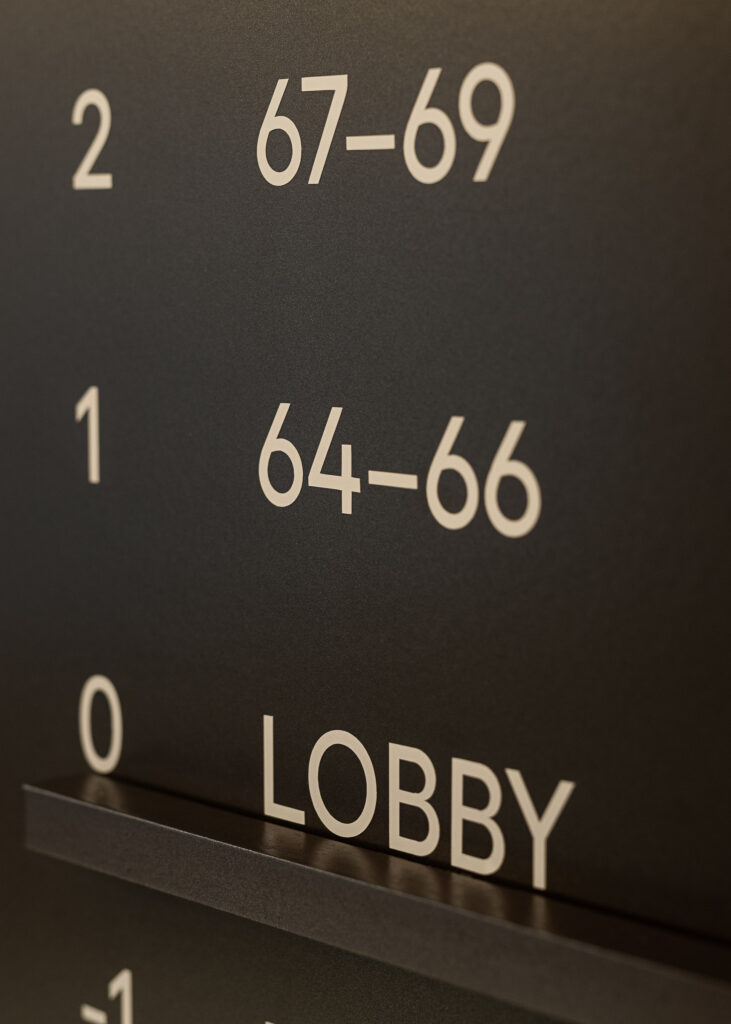 Detail of the typography of the elevator plate in the wayfinding system
