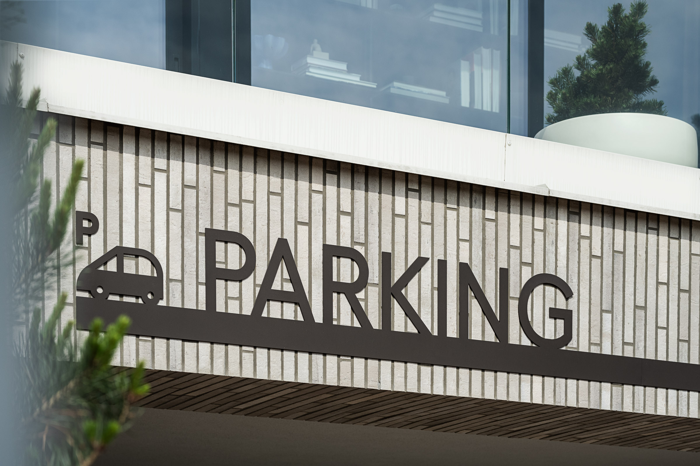 Parking signage element above the entrance