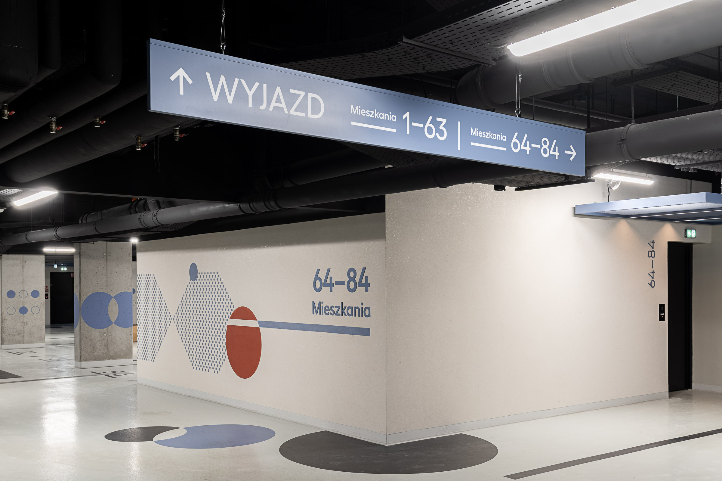 Hanging directional elements in the underground parking signaletik wayfinding system leitsystem orienterungssystem